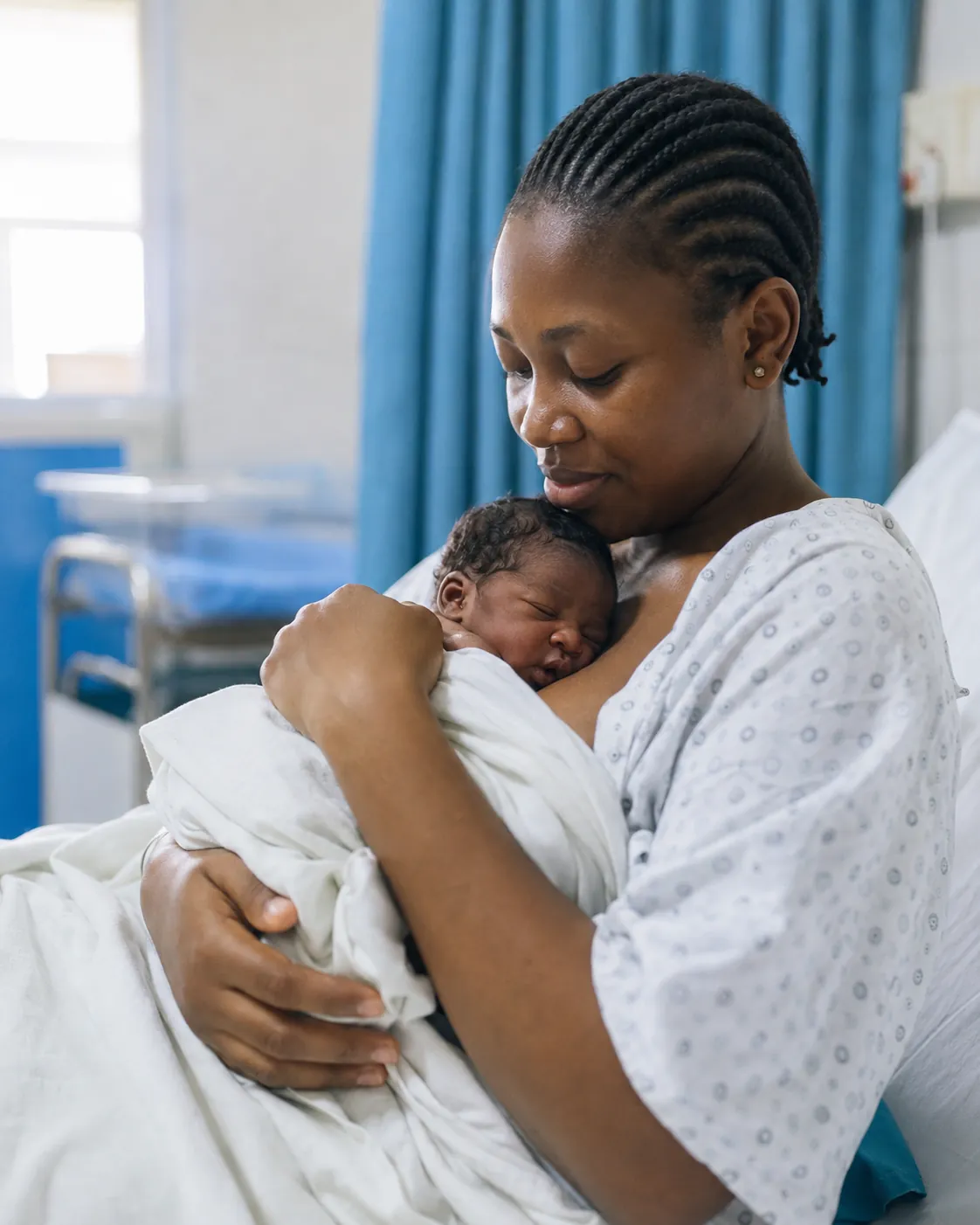 Mother and newborn on the maternity ward. Mother and baby stay together unless there is a clinical reason to separate them.
